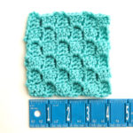 C2C Crochet block with ruler showing gauge
