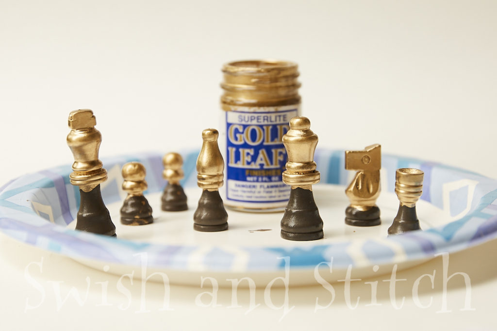 half gilded chess pieces