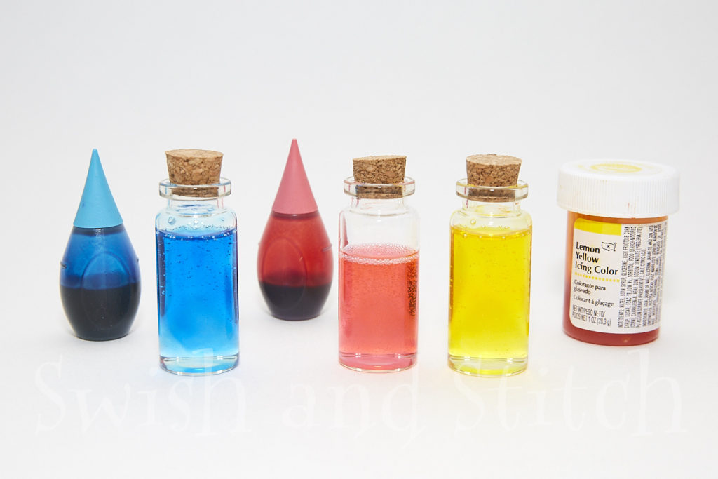 colored glue filled potion bottles