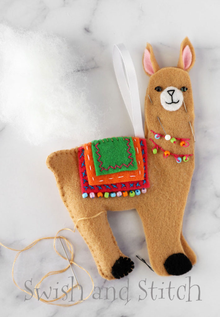 stitching and stuffing the felt llama ornament