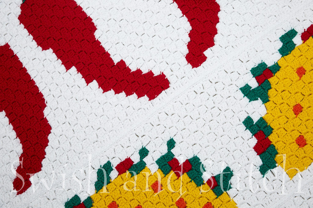 fiesta c2c crochet closeup with chile peppers and tacos