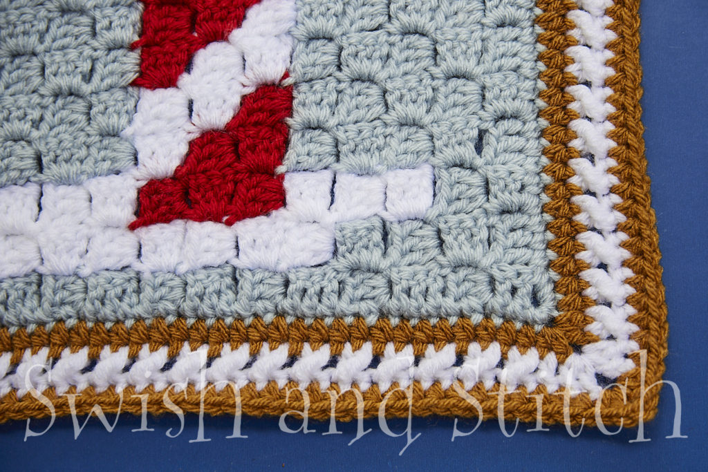 closeup of Gingerbread Cookie Lane C2C Crochet Christmas afghan border