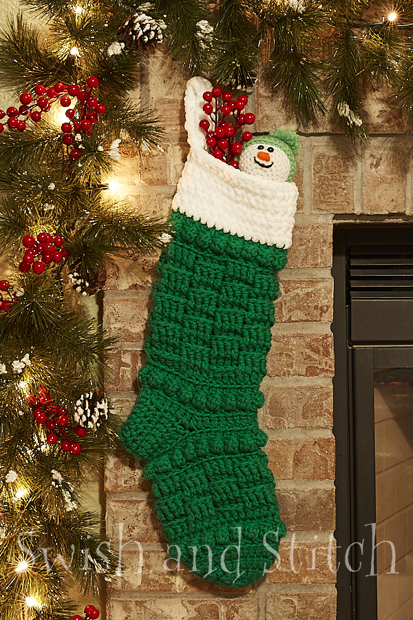 Telluride Crochet Christmas Stocking green by fireplace