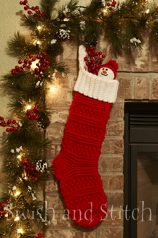 red aspen crochet christmas stocking with snowman ornament