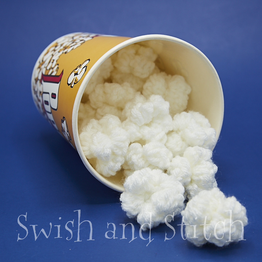 Crochet popcorn spilling from tub