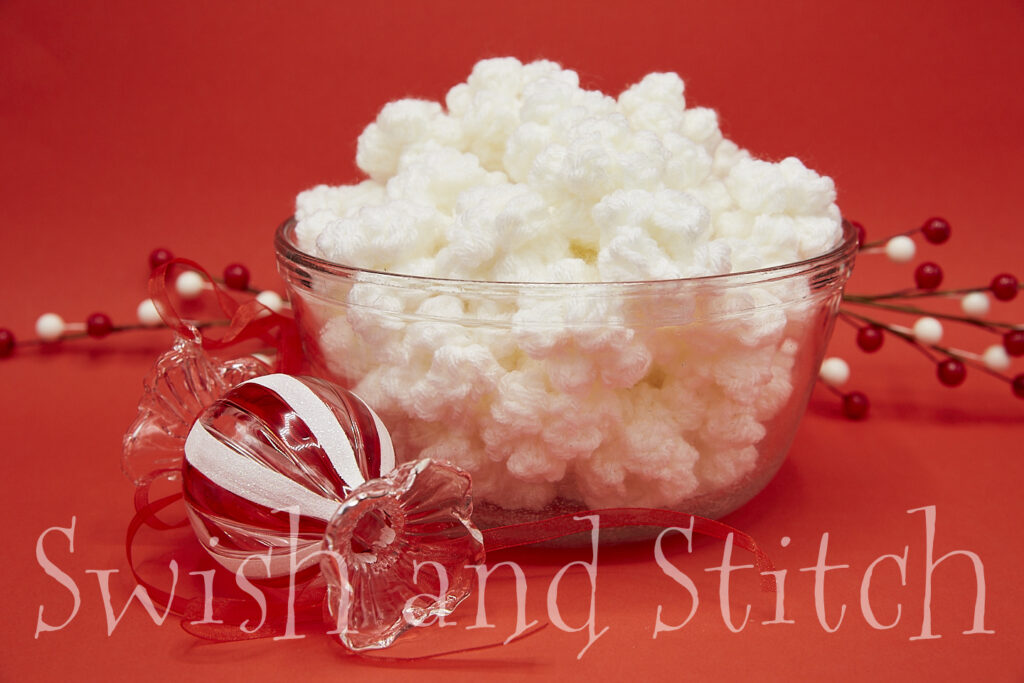 crochet popcorn in bowl with Christmas ornament