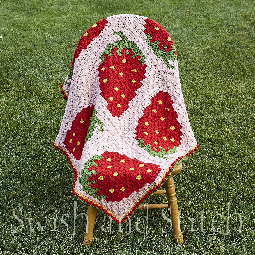 Strawberry Fields Afghan on chair outdoors