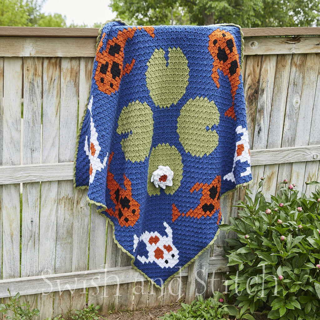 Tranquil Koi Pond C2C Croceht Throw Afghan on fence