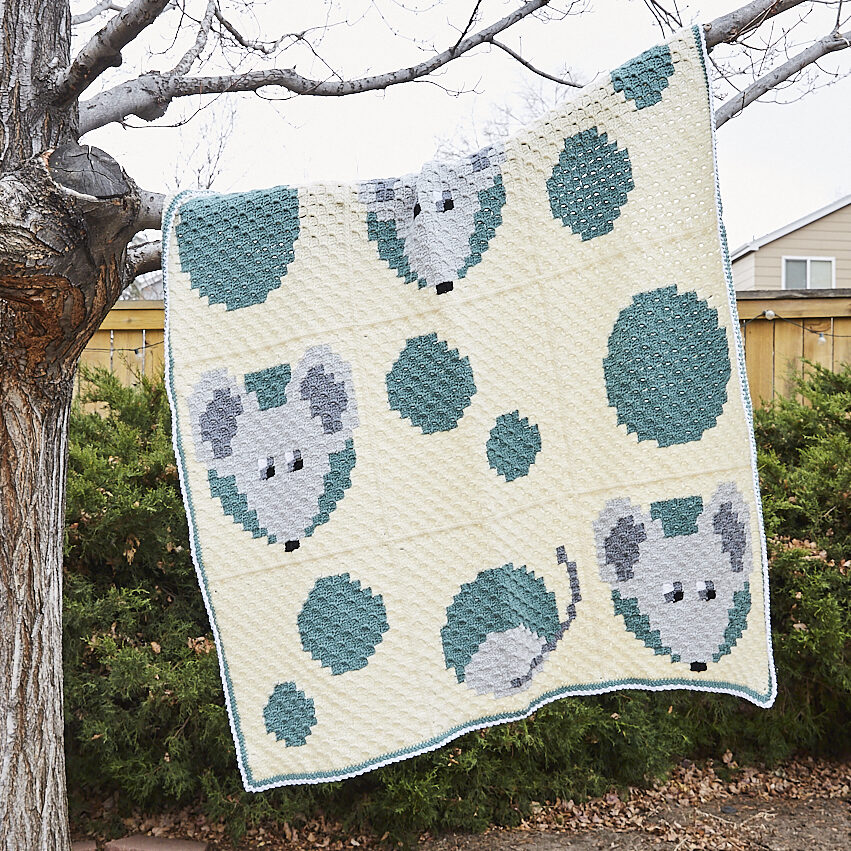 Mice in swiss cheese afghan in tree