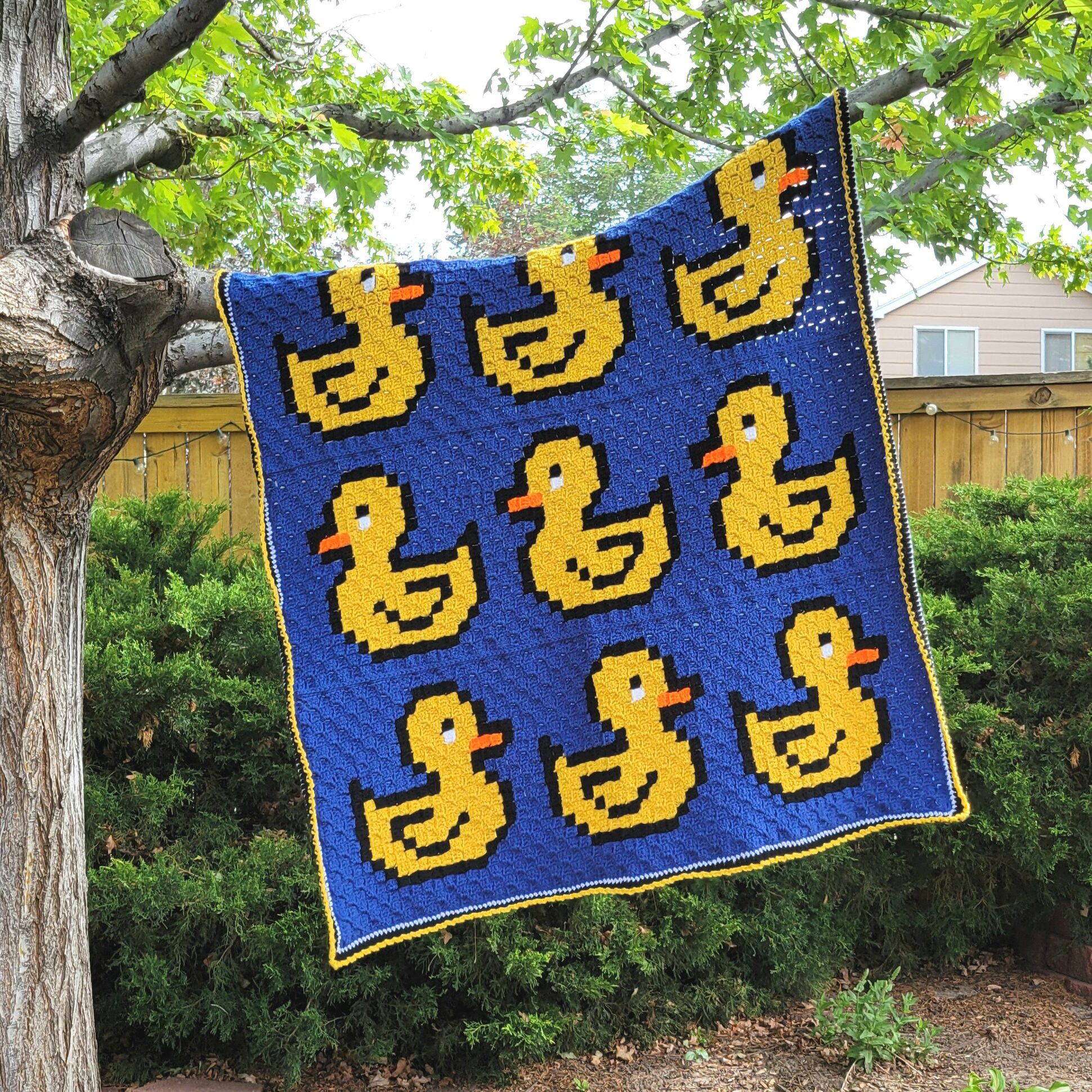 Ducks in a Row C2C Crochet Afghan hanging in tree