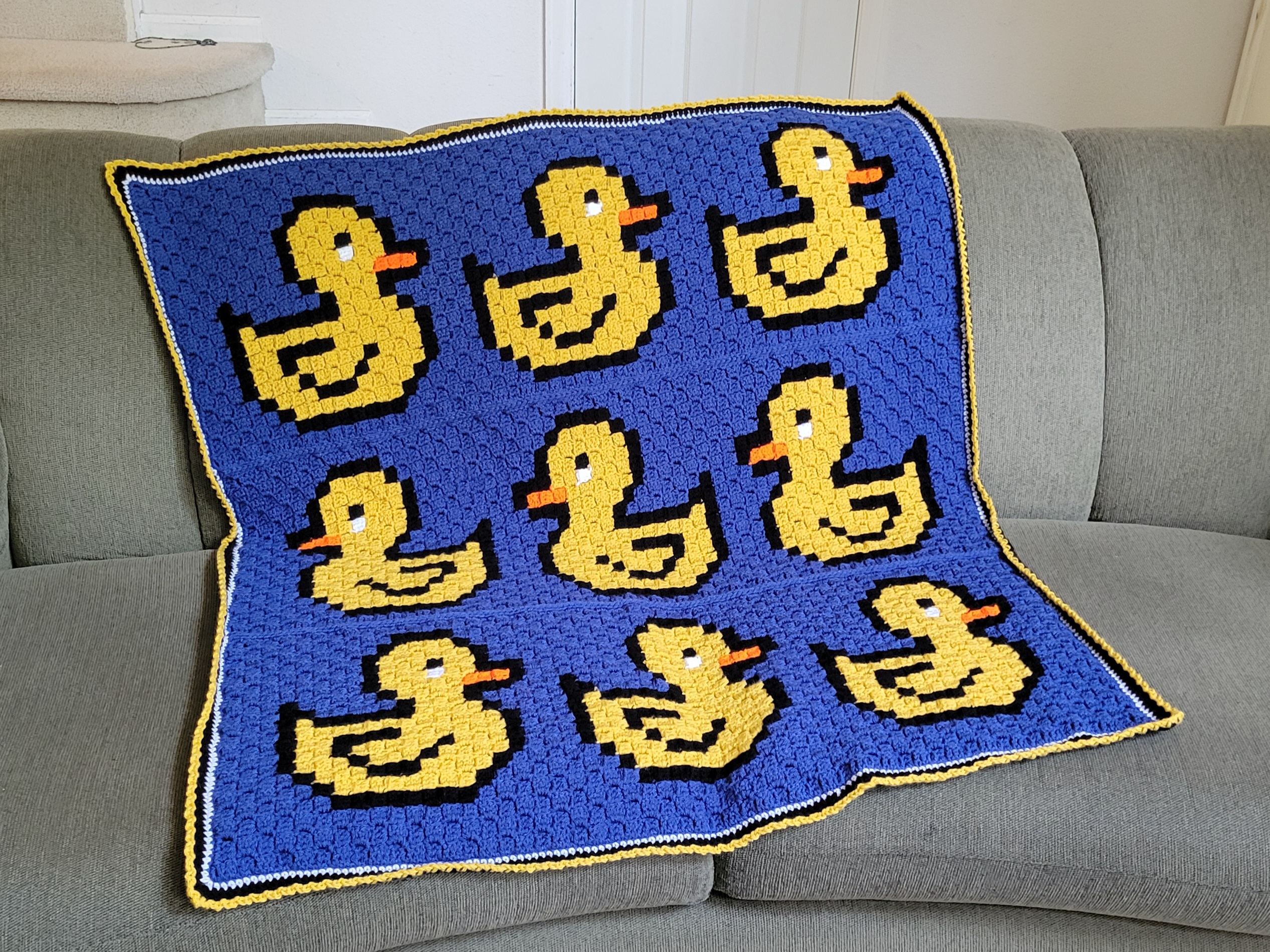 Ducks in a Row C2C Crochet Afghan spread out on couch